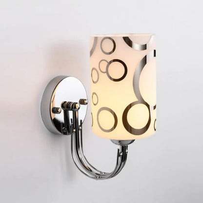 Chrome glass wall sconce with circular-pattern shade and dual curved arms by Decorbites on Tampa Home & Garden Store
