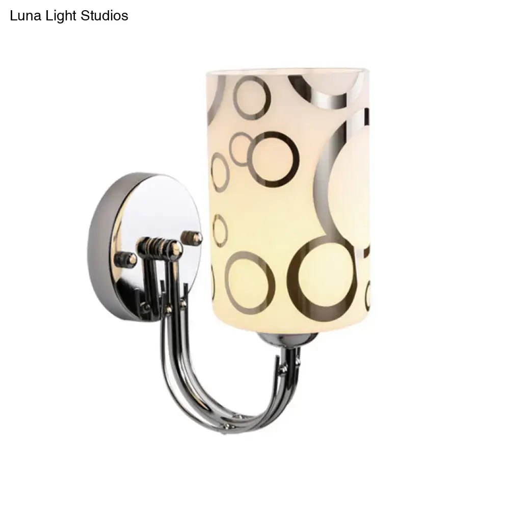 Chrome glass wall sconce by Decorbites with frosted cylindrical shade and circular motif on Tampa Home & Garden Store