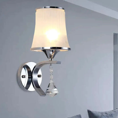 Modern chrome wall sconce with frosted glass shade and hanging crystal pendant Decorbites on Tampa Home & Garden Store