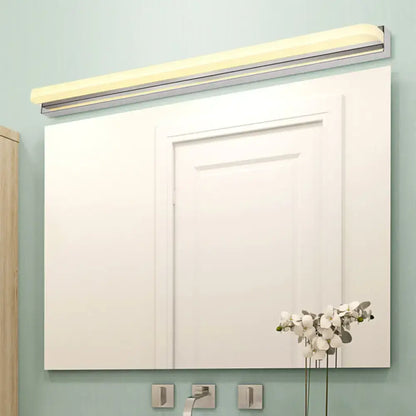 Chrome Cylinder Vanity Light Decorbites over a white-framed bathroom mirror on teal wall on Tampa Home & Garden Store