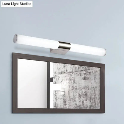 Chrome cylindrical vanity light by Decorbites, wall-mounted above a framed mirror on Tampa Home & Garden Store