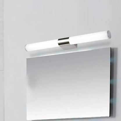 Chrome cylindrical vanity light with frosted tubes above a rectangular mirror on a light wall on Tampa Home & Garden Store