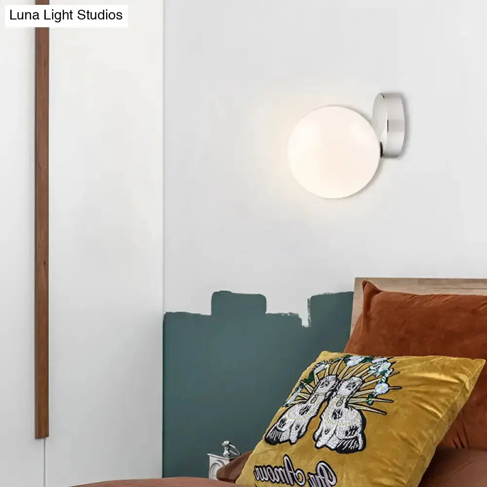 Modern chrome milk glass globe wall lamp with white globe by Decorbites on Tampa Home & Garden Store