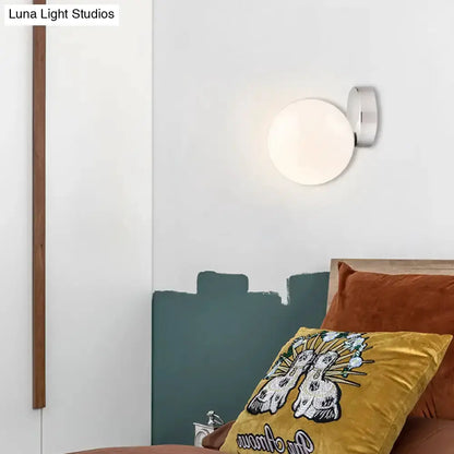 Modern chrome milk glass globe wall lamp with white globe by Decorbites on Tampa Home & Garden Store