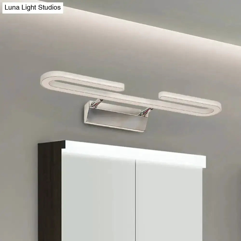 Decorbites modern chrome paper-clip LED vanity light fixture above bathroom mirror on Tampa Home & Garden Store