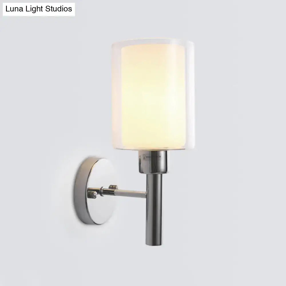 Chrome pencil arm wall sconce with frosted glass shade by Decorbites on Tampa Home & Garden Store