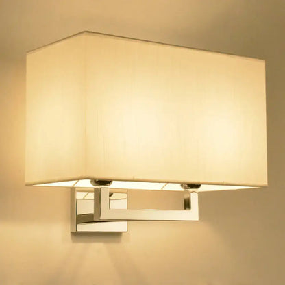 Chrome fabric wall sconce by Decorbites with a square cream shade, wall-mounted on Tampa Home & Garden Store