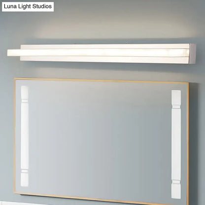 Chrome LED bathroom sconce by Decorbites, slim horizontal wall light above a framed mirror on Tampa Home & Garden Store