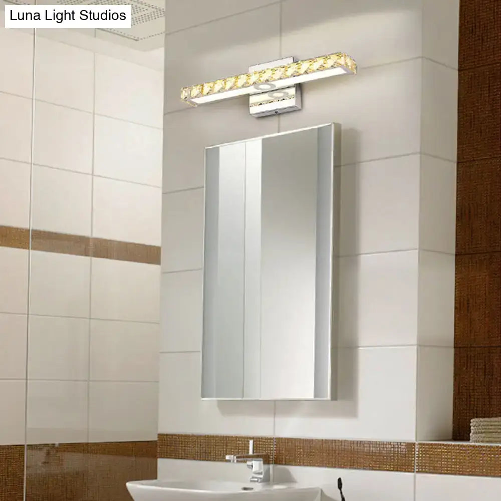 Decorbites chrome linear wall sconce with crystal accents above bathroom mirror on Tampa Home & Garden Store