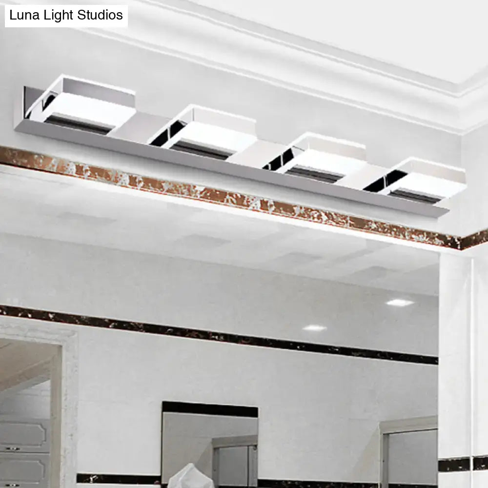 Chrome acrylic vanity light by Decorbites, four square fixtures on a metal bar on Tampa Home & Garden Store