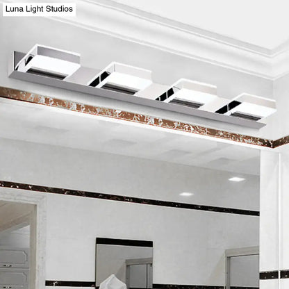 Chrome acrylic vanity light by Decorbites, four square fixtures on a metal bar on Tampa Home & Garden Store