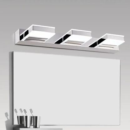 Decorbites chrome acrylic vanity light three-light bar over a bathroom mirror on Tampa Home & Garden Store
