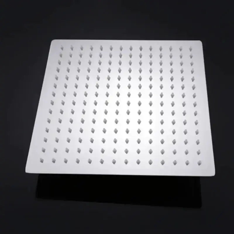 Square chrome rainfall shower head with white face and grid of nozzles Decorbites on Tampa Home & Garden Store