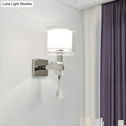 Chrome crystal glass wall sconce with white shade and dangling crystal pendant on Tampa Home & Garden Store