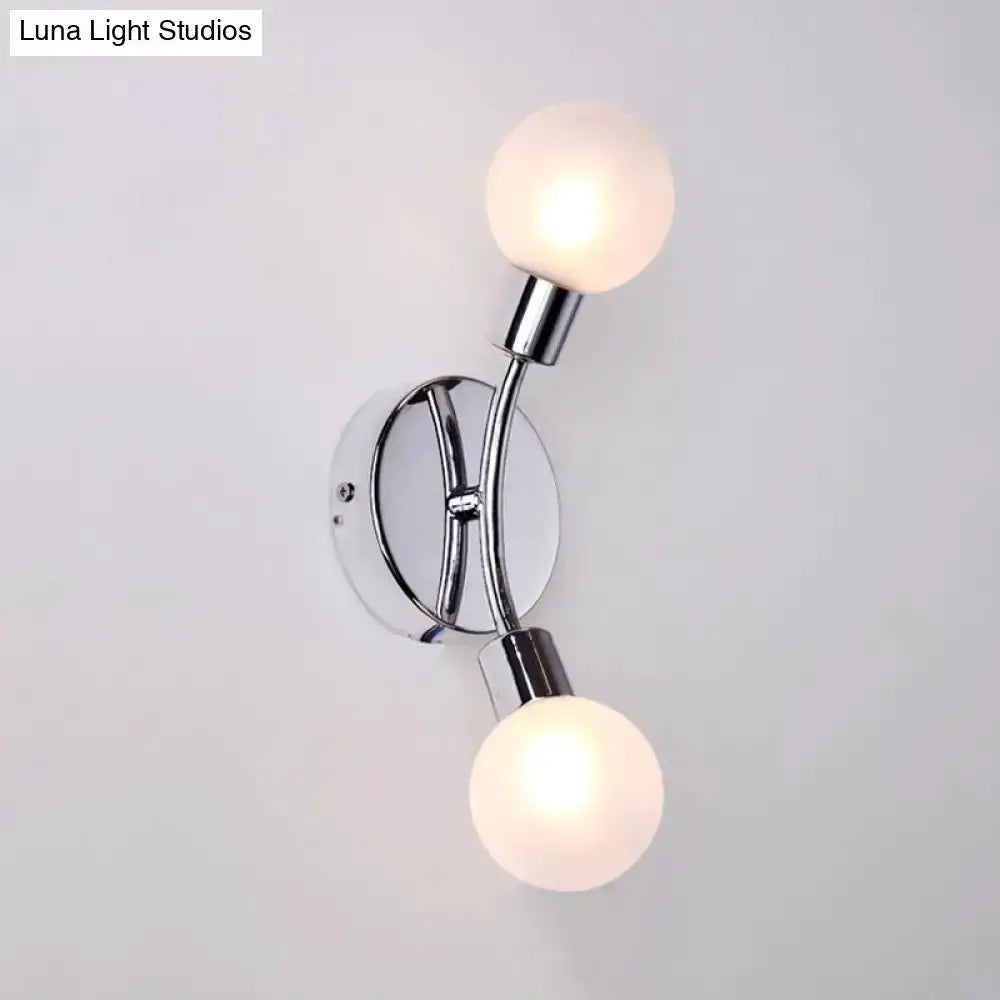 Modern chrome wall lamp with dual frosted white glass globes, bedroom sconce on Tampa Home & Garden Store