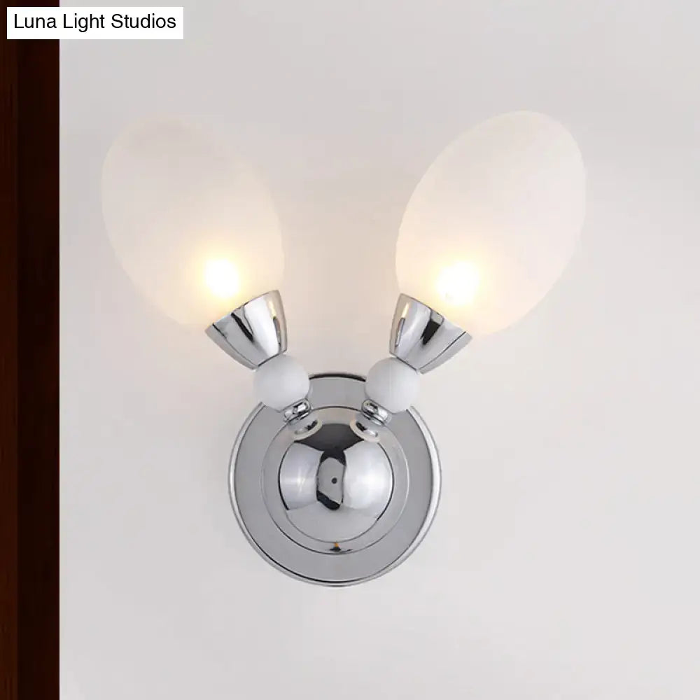 Chrome Dual-Light Wall Sconce with twin frosted glass shades on Tampa Home & Garden Store