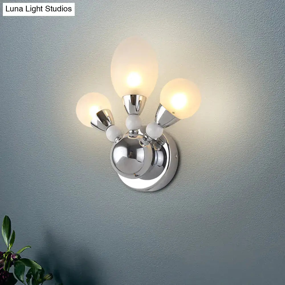 Decorbites chrome glass wall sconce with three frosted globe bulbs on Tampa Home & Garden Store