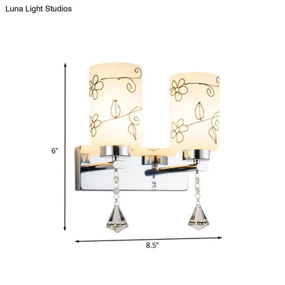 Decorbites Chrome Glass Cylinder Floral Sconce with dual frosted shades and crystal pendants on Tampa Home & Garden Store
