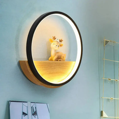 Black Deer Wall Light by Decorbites, circular black ring with warm wood shelf glow on Tampa Home & Garden Store