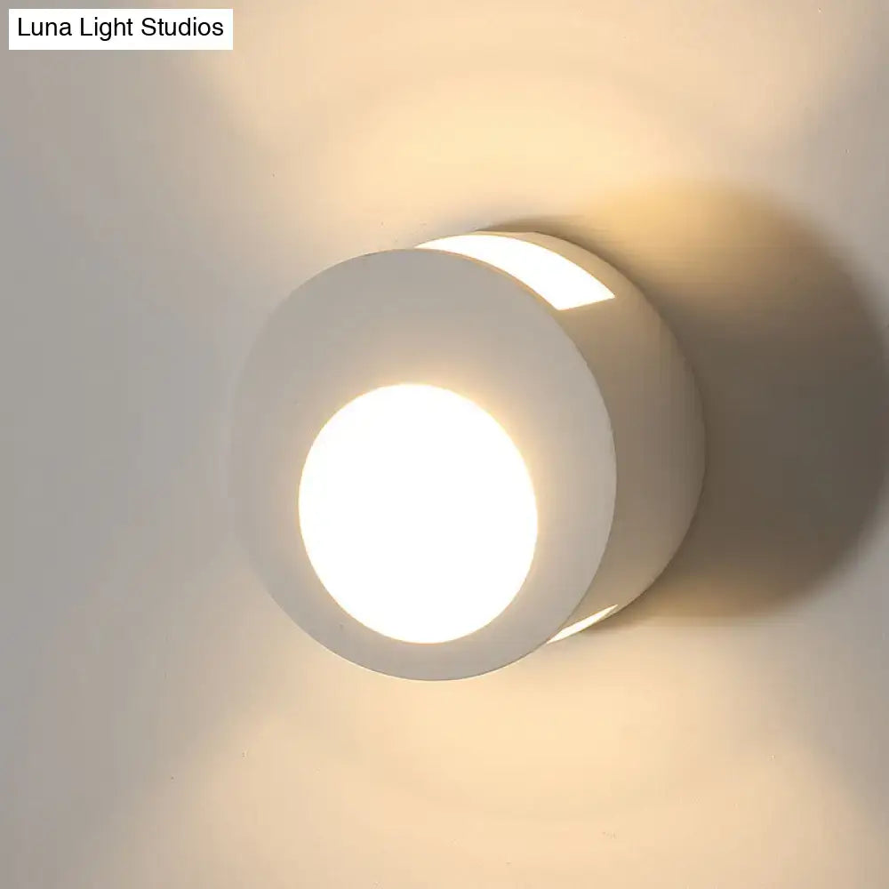 White gypsum LED wall sconce with rounded circular shade and warm glow Decorbites on Tampa Home & Garden Store