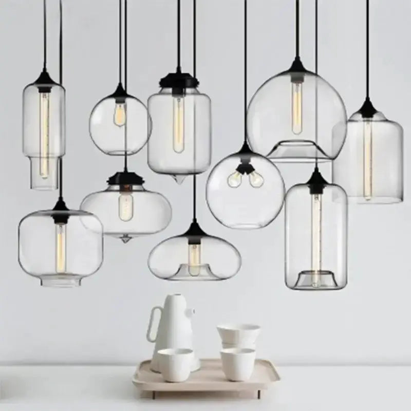 Decorbites modern glass bowl pendant lights, multiple clear glass pendants with black canopies on Tampa Home & Garden Store