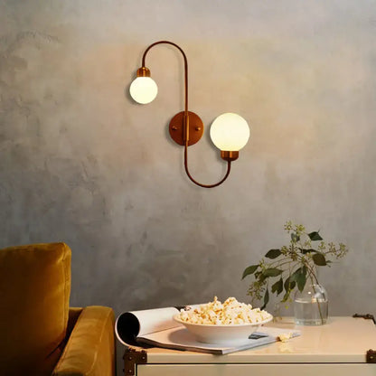 Copper Spherical Wall Sconce with dual frosted glass globes, Decorbites copper finish on Tampa Home & Garden Store