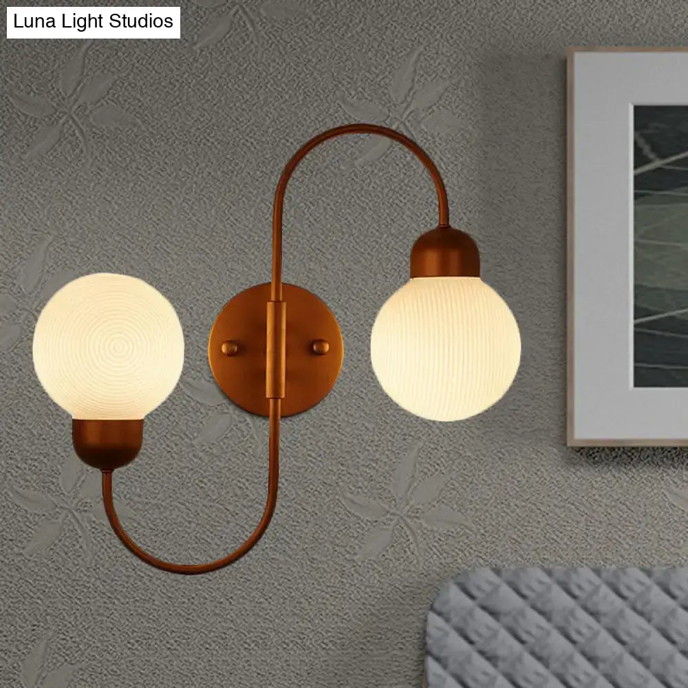 Decorbites copper spherical wall sconce with dual frosted glass globes on Tampa Home & Garden Store