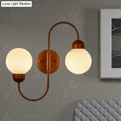 Decorbites copper spherical wall sconce with dual frosted glass globes on Tampa Home & Garden Store