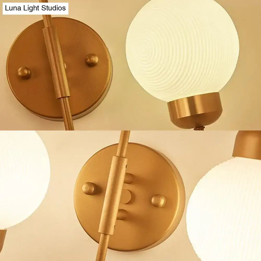 Decorbites copper-brass wall sconce with 2 frosted glass globes on Tampa Home & Garden Store