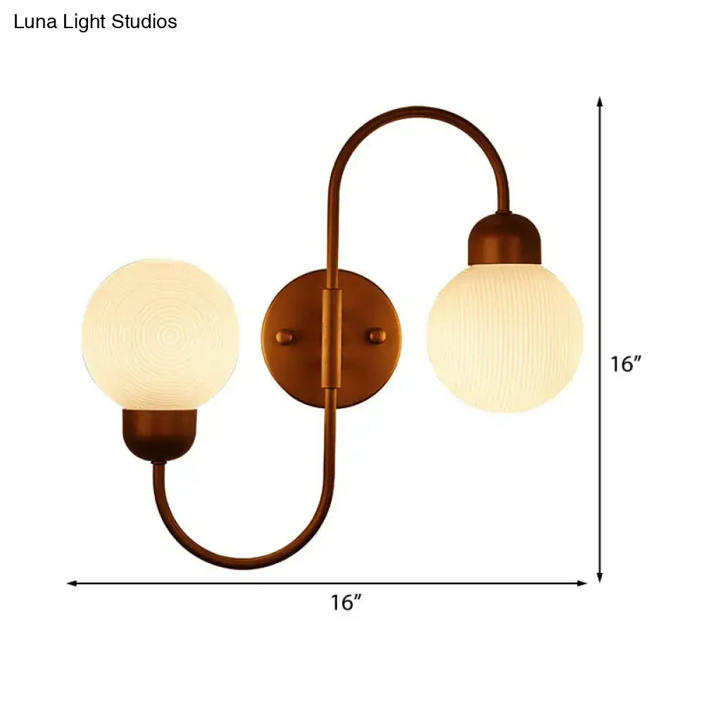 Copper spherical wall sconce with frosted glass globes on curved arm and backplate 16 in wide on Tampa Home & Garden Store