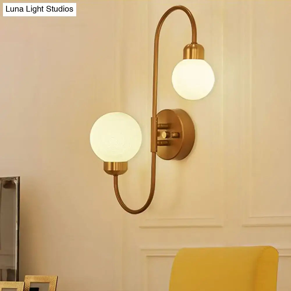 Copper double-globe wall sconce by Decorbites with frosted globes on Tampa Home & Garden Store