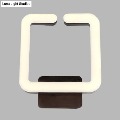 Cream square wall sconce by Decorbites with a glowing white frame and dark brown mount on Tampa Home & Garden Store