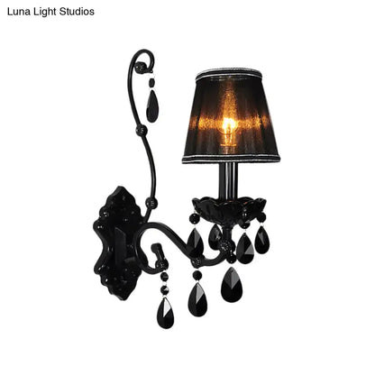 Black crystal wall sconce with cast iron shade and curved iron arm by Decorbites on Tampa Home & Garden Store