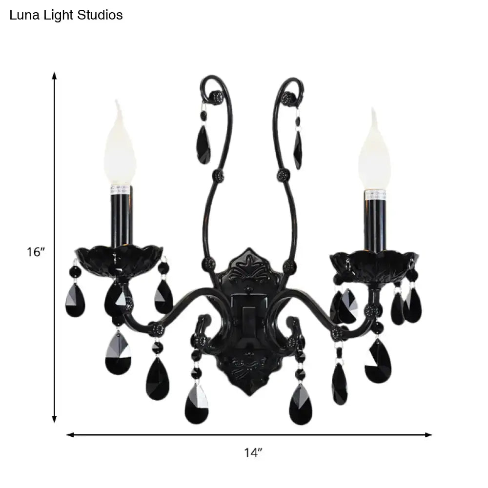Black crystal wall sconce with 2 candle lights and hanging crystals on cast-iron frame on Tampa Home & Garden Store
