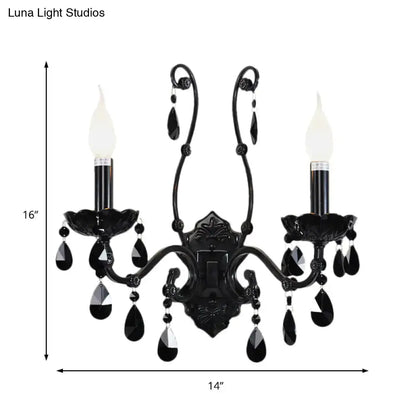 Black crystal wall sconce with 2 candle lights and hanging crystals on cast-iron frame on Tampa Home & Garden Store