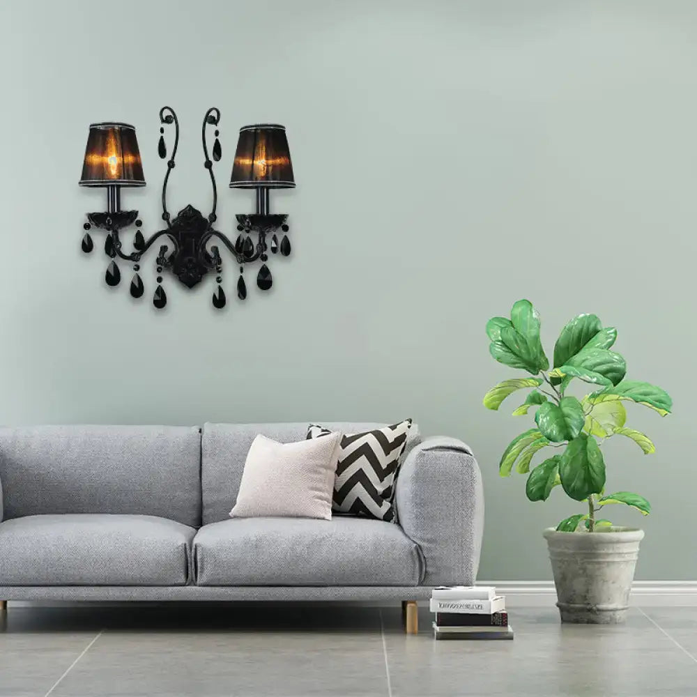 Black crystal wall sconce with cast iron frame and dual lampshades by Decorbites on Tampa Home & Garden Store