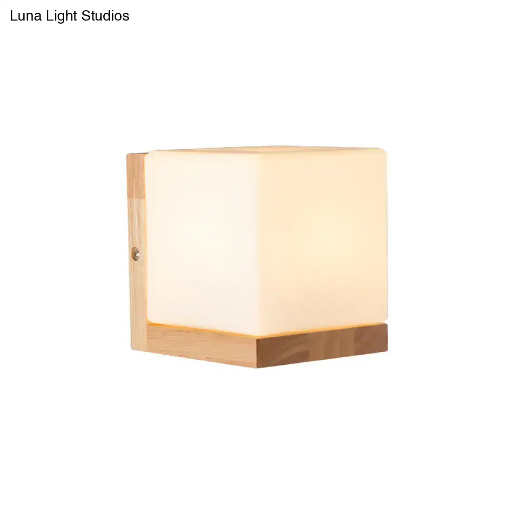 White cube wall sconce by Decorbites with frosted cube shade and wooden base on Tampa Home & Garden Store