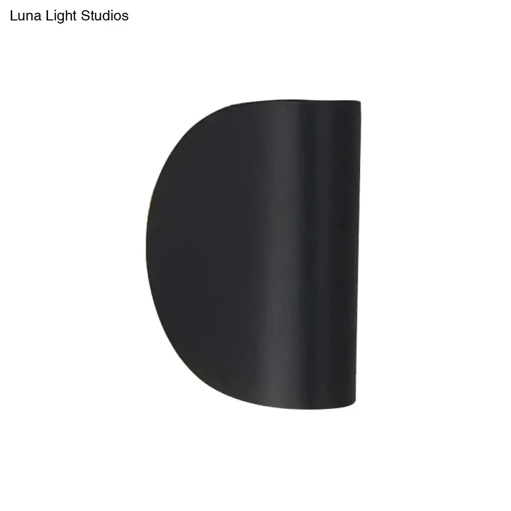 Black curved wall sconce light by Decorbites for bedroom ambient lighting on Tampa Home & Garden Store