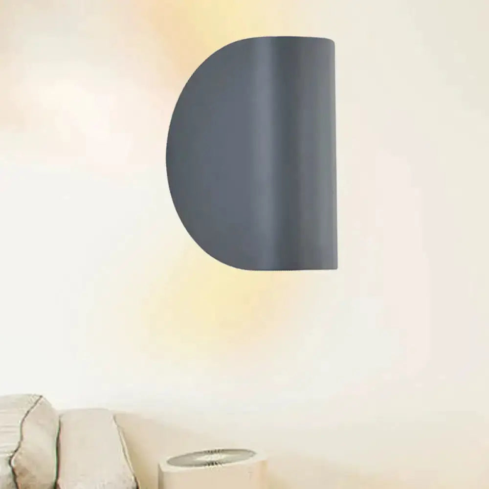 Dark gray curved metal wall sconce light for bedroom ambient lighting on Tampa Home & Garden Store
