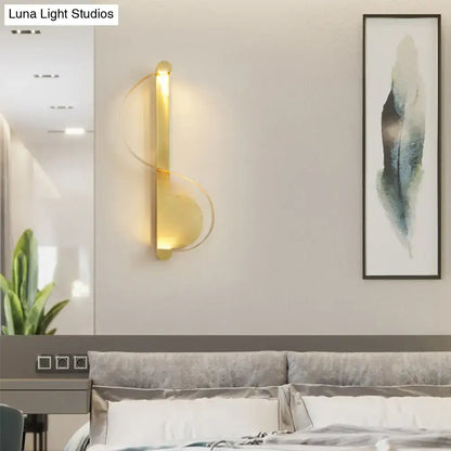 Gold curved aluminum wall sconce by Decorbites on beige living room wall above sofa on Tampa Home & Garden Store