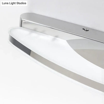 Chrome LED single-light vanity sconce with curved glass shade wall-mounted on Tampa Home & Garden Store