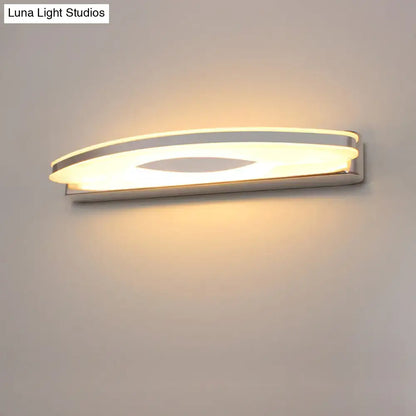 Chrome LED single-light vanity sconce by Decorbites with curved oval white diffuser wall mounted on Tampa Home & Garden Store