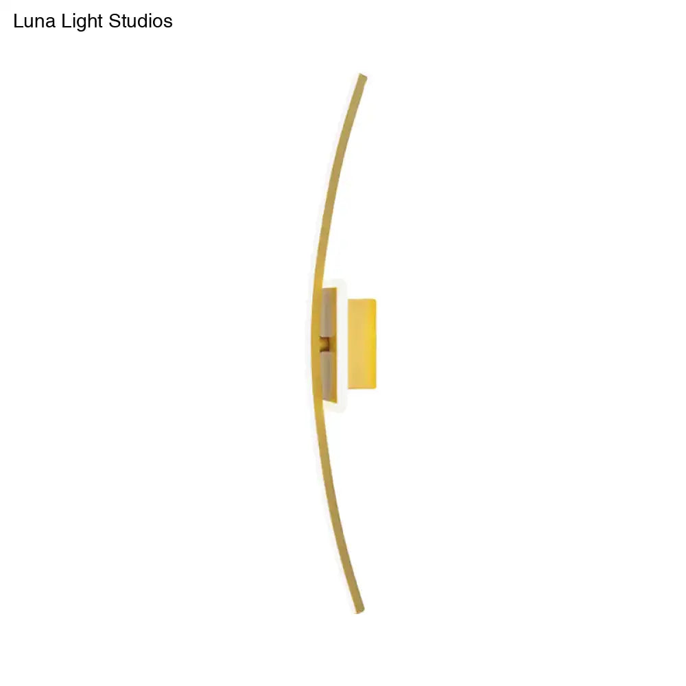 Gold coffee linear wall sconce Decorbites with curved gold metal arm and white wall mount on Tampa Home & Garden Store