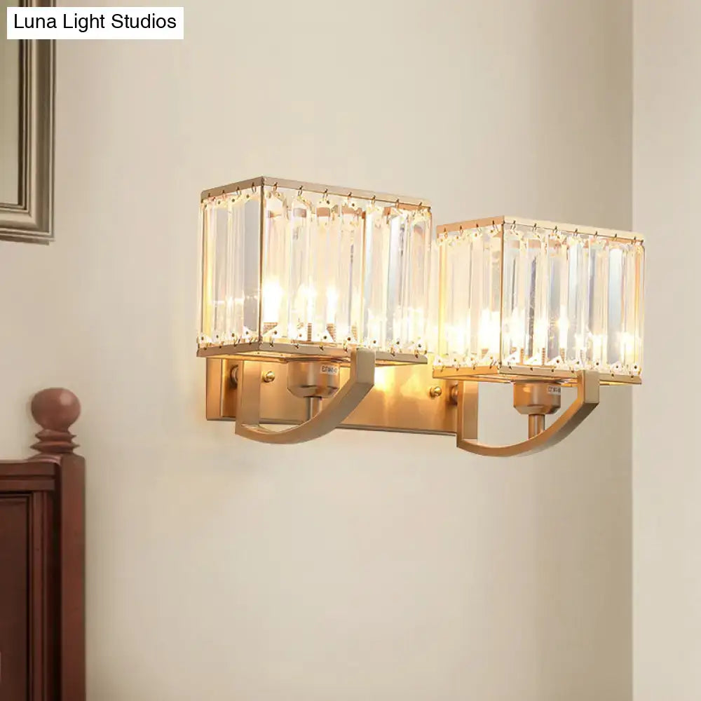 Crystal wall sconce light with twin rectangular crystal prisms in a gold brass frame by Decorbites on Tampa Home & Garden Store
