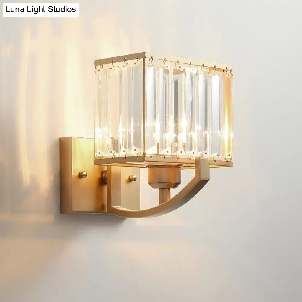 Crystal Wall Sconce Light by Decorbites; brass finish with glass crystal panels and curved arm on Tampa Home & Garden Store