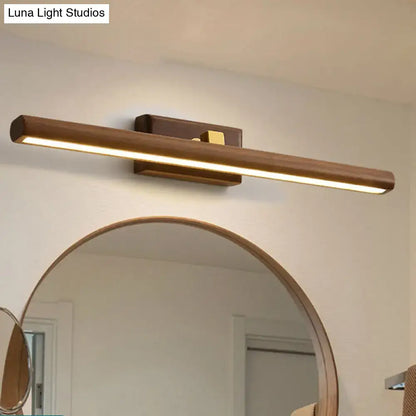 Dark wood linear wall sconce by Decorbites with brass mount and LED bar on Tampa Home & Garden Store