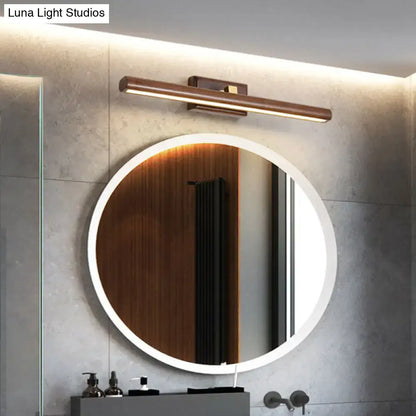 Dark Wood Linear Sconce warm LED wall light above round backlit bathroom mirror Decorbites on Tampa Home & Garden Store