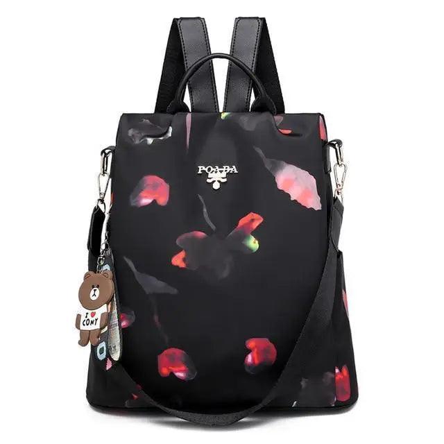 Stevvex waterproof black backpack with red floral print, anti-theft school bag with bear charm on Tampa Home & Garden Store
