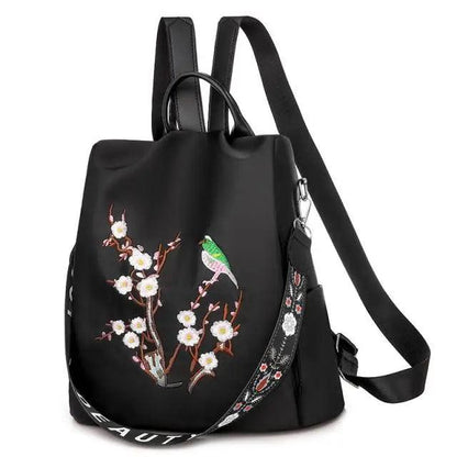 Women's school backpack Stevvex, black waterproof with floral embroidery and green bird on Tampa Home & Garden Store