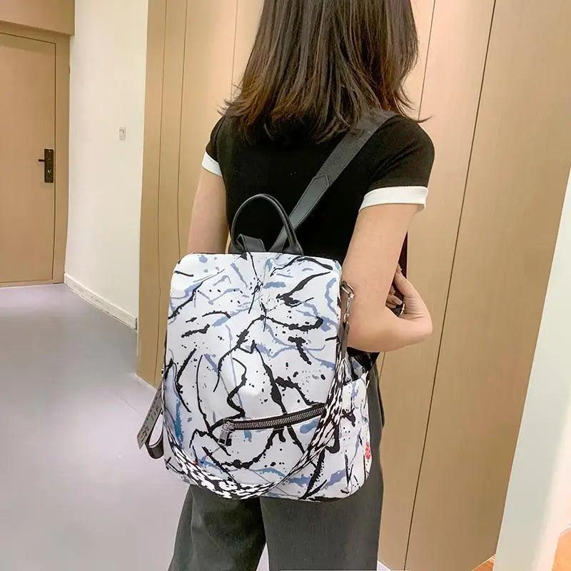 Stevvex ST27088EJO backpack white marble print with black abstract lines, waterproof school bag on Tampa Home & Garden Store